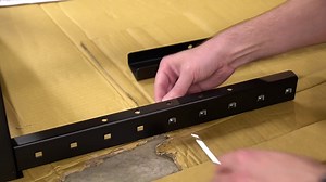 Installing cage nuts with an insertion tool