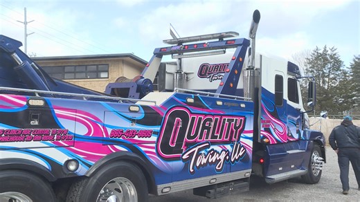 Heavy-duty tow trucks handle complex process of freeing stuck tractor-trailers
