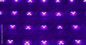 Macro shot of multicolored RGB diode blinking lights. LED colored dots led light panel with different effects.