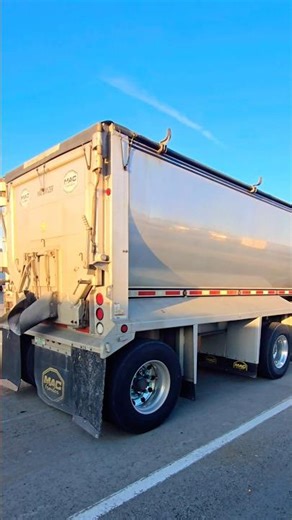 Custom Largecar Peterbilt pulling the polished spread axle half round mac dump trailer 😎