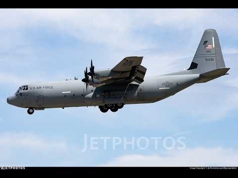 A U.S Air Force Lockheed C-130J-30 Super Hercules flying above the clouds during sunset at 21,000 ft