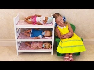 Diana - caring Mom playing with Baby Born Doll