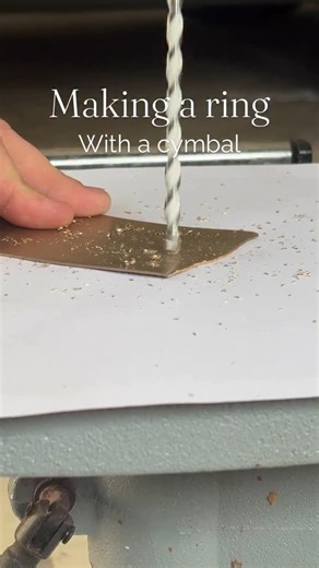 Rings By Blake on Instagram: "What do you think of this unique ring? 🥁 This ring was made on carbon fiber using shavings I made using the cutoff from an old cymbal I had repaired. This was a passion project of mine, however I still have lots of shavings left over and would be more than happy to make a few more! #uniquejewelry #drummer #cymbal #drums #giftideas #rings"