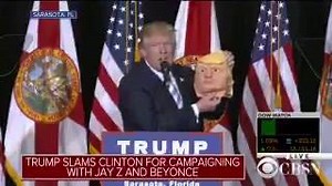 Donald J. Trump brings Halloween mask of himself on stage: "Nice head of hair!" | The Hill