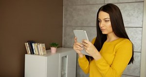 「Beautiful Young Woman Using Her Tablet」の動画素材（ロイヤリティフリー）26434154 | Shutterstock