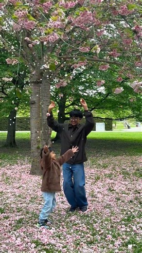 A little spring magic with two angels beneath the cherry blossoms 🌸✨🤍