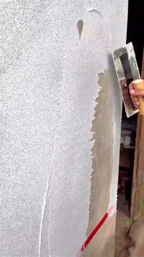 Applying a Textured White Cement Finish to an Outdoor Wall Using a Flat Hand Trowel Tool