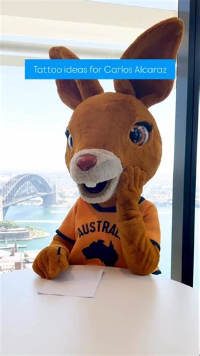 Australia on Instagram: "Serving @carlitosalcarazz some inspo for his Aussie ink 🎾 Help us showcase Ruby the roo’s designs by tagging Carlos below 👇 @australianopen #SeeAustralia #ComeAndSayGday ID: Text over video reads “Tattoo ideas for Carlos Alcaraz” as Ruby the souvenir kangaroo shows off sketches of herself for tattoo inspiration."