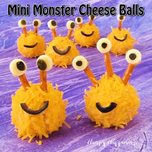 MINI MONSTER CHEESE BALLS? Eeeeek! So cute. Recipe here - http://hungryhappenings.com/halloween-food-mini-monster-cheese/ | Hungry Happenings