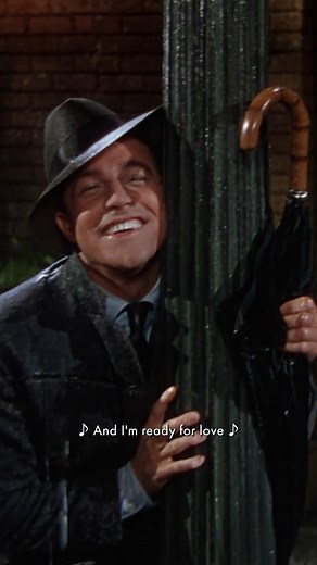 Rain can't stop a heart set on joy. Gene Kelly performing "Singin' in the Rain" from the musical film of the same name. SINGIN' IN THE RAIN received nominations for Actress in a Supporting Role (Jean Hagen) and Music - Scoring of a Musical Picture (Lennie Hayton) at the 25th Oscars. | The Academy