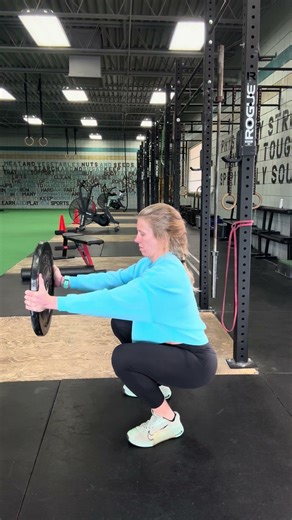 Plate in/out squats for trunk stability