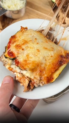 High Protein Zucchini Lasagna 1 medium zucchini, sliced lengthwise 1/2 lb ground beef, cooked and seasoned 3/4 cup shredded mozzarella cheese 1/2 cup full-fat cottage cheese 1/2 cup no-sugar-added marinara sauce Preheat oven to 375°F. Lightly grease a small baking dish. Layer the bottom with a few zucchini slices. Add half of the ground beef, then spoon over half of the marinara. Spread half of the cottage cheese, then sprinkle with half of the mozzarella. Repeat the layers with remaining zucchi