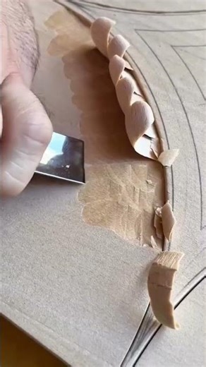 Woodworker Using Sharp Hand Chisel To Carve Decorative Pattern