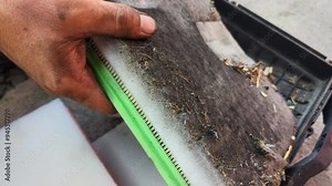 An engine air filter comparison showing an old, dirty filter next to a new, clean one. Highlights the importance of regular vehicle maintenance.