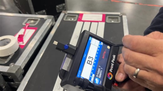 Using a PrintPeak handheld printer to shoot break out labels directly on 2” Gaff tape. (Yes you could do this with a $1 Sharpie, but it would take longer) | Dimmer Beach Monthly