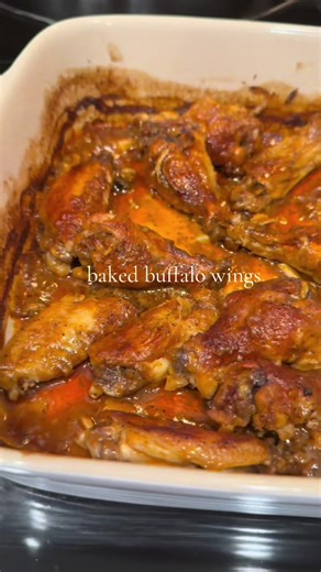 Baked buffalo wings marinated overnight in A buffalo sauce and baked until tender then finished off with a high broil for 3 mins for A crisp finish on top