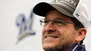 Who owns the Milwaukee Brewers and how did they make their money?