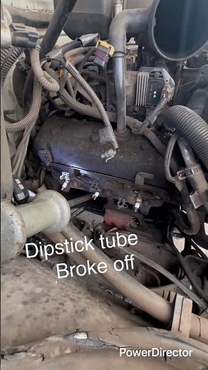 Chevy broken dipstick tube removal, using a snatch bar with a screw welded on the end.