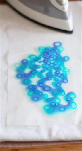 Alternative Suncatcher Method Create "Cellular" Art with Wax! 🎨 We’re back with a twist on our suncatcher method! By using a metal sharpener to create thinner, curlier shavings and ironing in a circular motion, you can create a gorgeous "cellular" pattern that looks like frozen water or microscopic art. Supplies: Blue crayons Metal handheld sharpener Waxed paper Iron Scissors This version creates a denser, more intricate pattern that looks stunning when the sun hits it. Which version do you pre