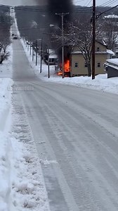 Bystanders watched in horror as a multi-ton fire truck, responding to a residential structure fire, became a victim of the treacherous winter conditions. The security footage shows the massive red truck attempting to navigate a steep, ice-glazed hill. Suddenly, the tires lose grip, and the vehicle begins a slow-motion spin, rotating completely until it is facing uphill while still descending. The driver can be seen wrestling with the wheel, but the laws of physics take over as the truck gains sp