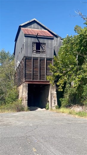Old railroad structure used to load hopper cars. Do you know the history?