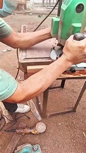 Hands guide router shaping wood grain surface