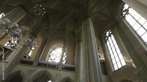 Gothic style interior with arcs and decoration in Catholic cathedral
