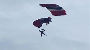 Red Devils Parachutist Tangles With Teammate in Mid-Air