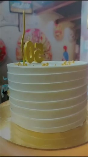 Gáñèsh ßâkërs & Fãst Föōd Pøïñt on Instagram: "@ganesh_bakers_fast_food_point 📍🧿🎂This is an anniversary cake, likely for a 50th or "golden" anniversary. The cake is a white, round cake with horizontal ridged frosting. It is decorated with a gold "Happy Anniversary" topper and gold "50" numbers. There is also a single gold candle and some floral decorations. The golden color scheme is traditionally associated with the 50th anniversary, often called the "golden jubilee". . . #bakers #chocolate 