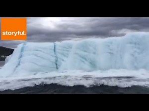 Watch this huge iceberg flip over in the water