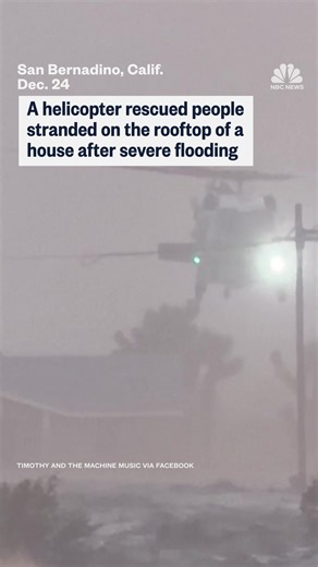 A helicopter rescued people stranded on the rooftop of a house after severe flooding in San Bernadino, California. | NBC News