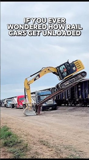 How to unload the sand from a railcar to a dump truck using ramps and an excavator.