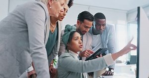 Computer, team work or woman with help from business people and working on a digital marketing SEO strategy. Collaboration, question or senior manager in a meeting with employees at a digital agency