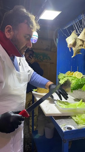 Delicious Street Food Preparation in a Bustling Market