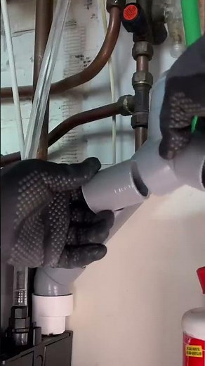 A plumber shows how to connect a condensate pump