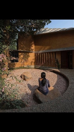 JACKFRUIT GARDEN RESIDENCE, KERALA, INDIA Project Overview Wallmakers has designed the Jackfruit Garden Residence, prioritising sustainability and harmony with nature. Design Highlights 1. Compound wall twisting around a majestic jackfruit tree, creating an intimate Japanese Zen garden. 2. Sustainable materials: Compressed Stabilised Earth Blocks (CSEB) and Rammed Earth Walls. 3. Ferro-cement shell roof reducing cement consumption by 40% and steel consumption by 30%. Project Details - Architects