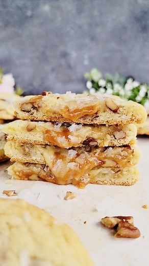 These Coconut Caramel Pecan Cookies are buttery, soft and have thick gooey, caramel loaded centers. The crunchy pecans and coconut flakes add the perfect texture and flavor to these. These can be mixed in one bowl in just a few minutes and take only 10 minutes to bake. You can find the full recipe on my blog, simplecookingwithpep.com. In the search box, type Coconut Caramel Pecan Cookies. Here are a few tips. These cookies have cornstarch in the batter. This helps the cookies have thicker center