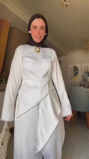 Shine with timeless elegance ✨ Our fall best evening wear satin pants set features a V-cut beaded top with detailed sleeve borders and wide leg pants — perfect for your next special occasion. satin pants set, beaded top, V cut, evening wear, fall fashion, طقم سواريه, ستان, لمعة, موضة خريف, إطلالة سهرة #eveningwear #fallcollection #satinset #fashiontrend #ستايل #موضة #سواريه #إطلالة | Cairo Fashion Boutique