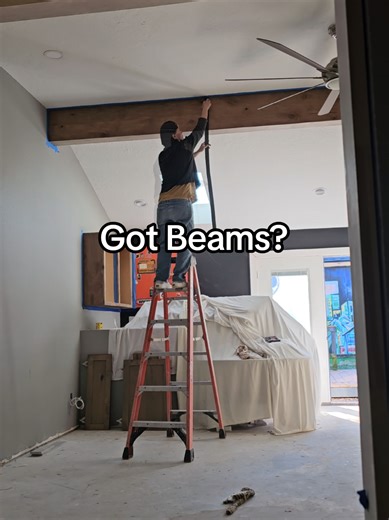 Beams wrapped in knotty alder with faux iron beam straps to hide the seams until I get the real iron ones made 😉 #homeremodel #faux #beams #artistlife