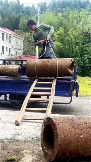 Genius Loading Hack: One Man Moves Heavy Cement Pipes Efficiently