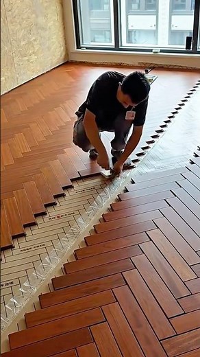 Wood Flooring Installation Process Using Herringbone Pattern for Interior Design