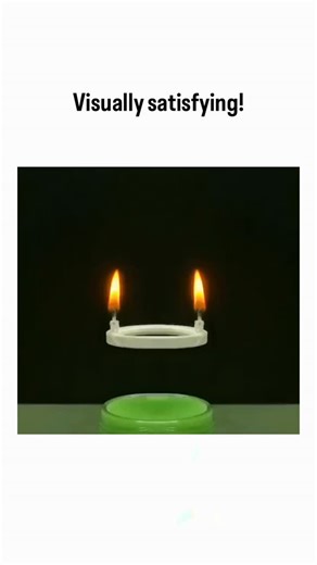 Explainer_Zone on Instagram: "- The video shows an orange spherical object dropping onto dual lit candles above a green container, melting into eerily symmetric, elongated shapes that evoke fluid dynamics under controlled heating. - Posted by physics enthusiast @ScienceExpand, it emphasizes visual appeal over explanation, drawing 1.3 million views and 7,500 likes for its hypnotic precision. - Replies split between awe at the “satisfying” effect and doubts of editing, noting chaos theory predicts