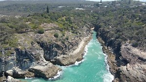 Splashing Sea Water At North Gorge Walk In Point Lookout, Queensland, Australia. drone descend