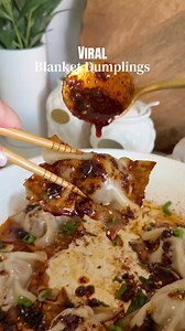 VIRAL BLANKET DUMPLINGS Recipe Ingredients \t•\t1 lb ground pork \t•\t1 small carrot, grated \t•\t2 green onions, chopped \t•\t2 garlic cloves, minced \t•\t1½ tsp freshly grated ginger \t•\t2 tbsp soy sauce \t•\t1 tsp sesame oil \t•\t1 tbsp mirin \t•\t½ tsp white pepper \t•\t20–22 wonton wrappers \t•\tOil for the pan For serving \t•\tChili oil \t•\tSoy sauce \t•\tSesame seeds \t•\tGreen onions Instructions \t1.\tIn a bowl combine ground pork, grated carrot, green onions, garlic, ginger, soy sauc