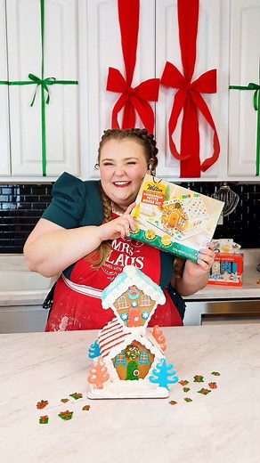 Gingerbread House Inspiration 🏡💖 We challenged Sweet Kate Bakery to get creative with our Ready to Build Petite Gingerbread House Kit and she delivered! Would you get creative in the kitchen and flex your gingerbread house constructing skills to make a two-story, Whoville-inspired abode? | Wilton Cake Decorating