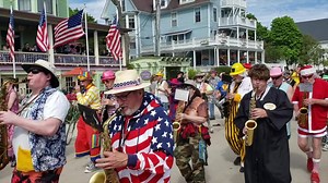 Greetings from Mackinac Island with a look back at some of the Scottville Clown Band's past performances!! Save the dates for 2021: June 4-13! 🐴💜🌸 #MyMackinac #MackinacLilacFest | Mackinac Island Tourism Bureau