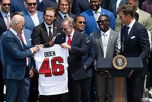 Super Bowl Champion Tampa Bay Buccaneers, including Tom Brady, visit the White House and present President Biden with a custom jersey. | Forbes
