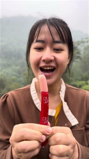 How to peel a sausage before eating it #bushcraft #survival #camping #shorts