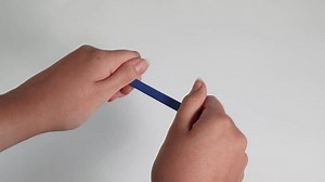 Sequence of snapping a plastic band by hand