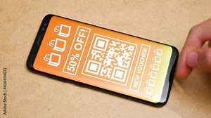 Man browsing various store coupons on his smartphone, finger swiping through many promo coupon code templates, lots of deals, sales discount codes, mobile advertisement, internet marketing concept